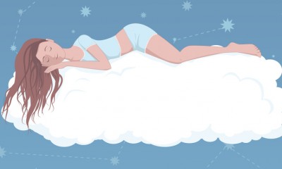 Cartoon of woman sleeping on a cloud